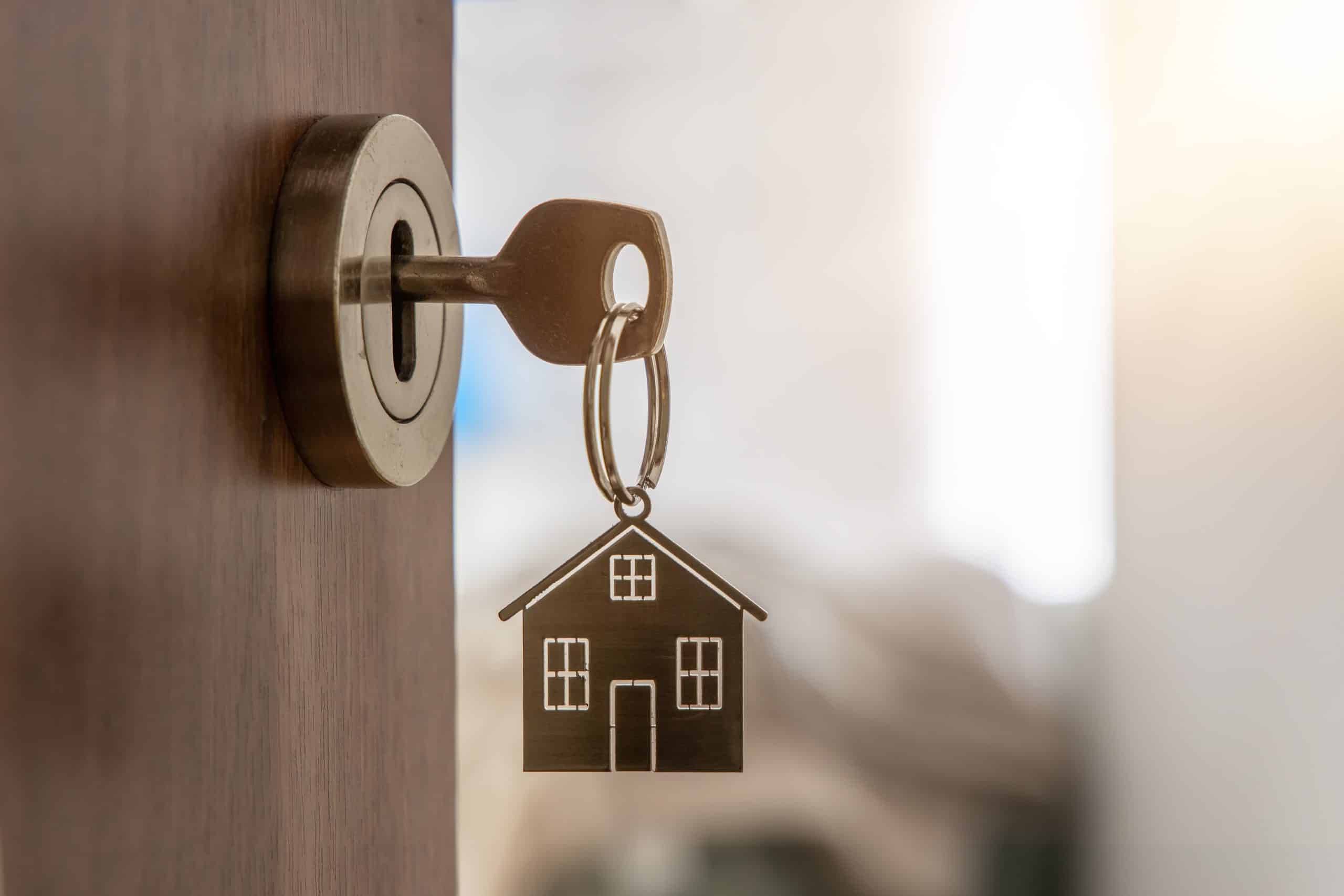 Key in a lock with a house keyring.